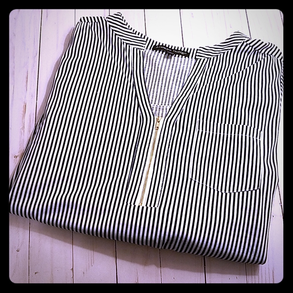 Black and white striped top, with gold zipper